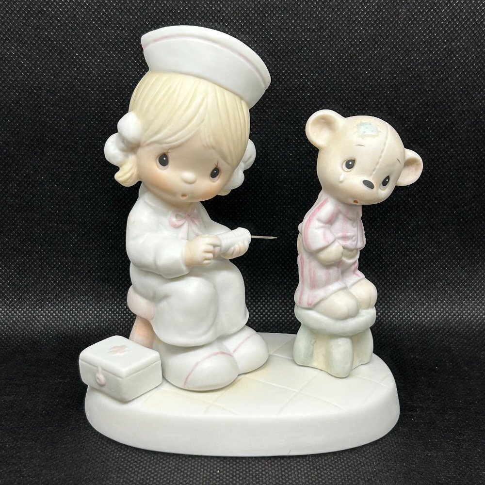 Precious Moments “Love Beareth All Things” figurine